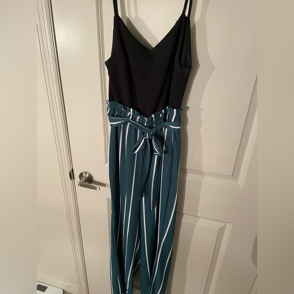 Black top with green striped bottoms jumpsuit